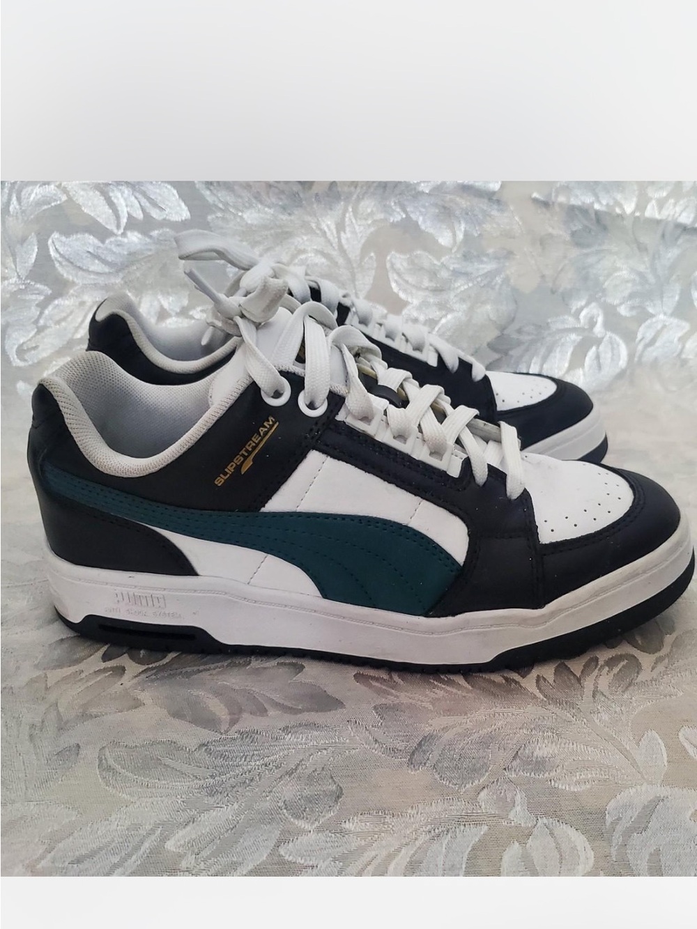 Puma women’s White Black Teal Low-Top Sneakers